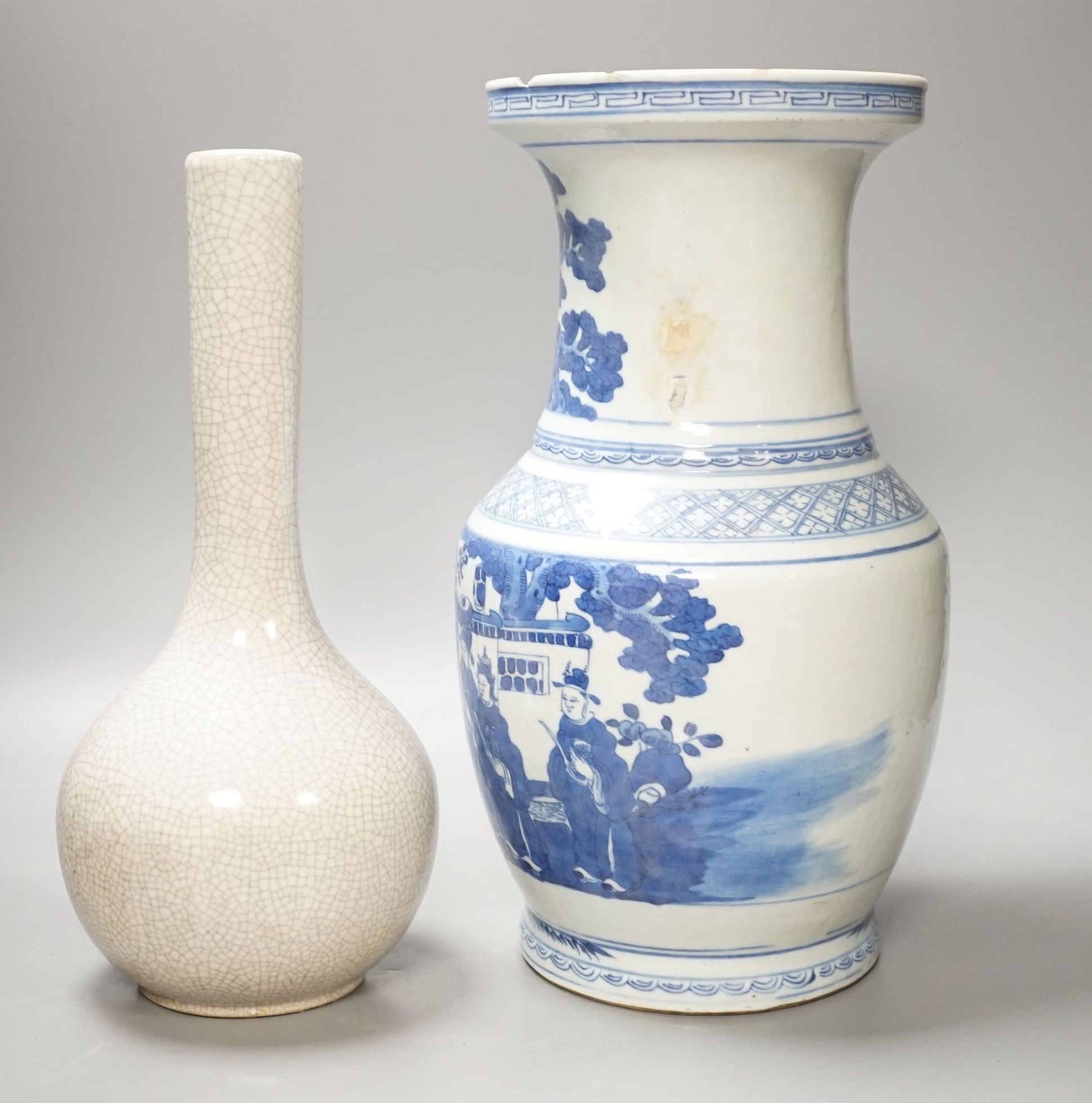 A Chinese blue and white vase and a crackle glaze bottle vase, tallest 34.5 cms high.